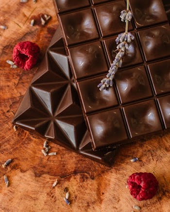 Brown Chocolate Bars and Two Raspberries