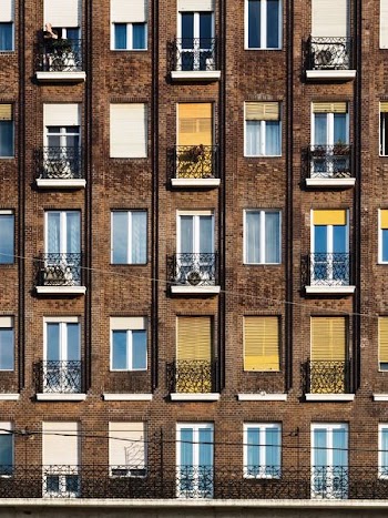 brown concrete apartment during daytime