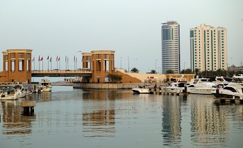 Brown Concrete Bridge and Boats