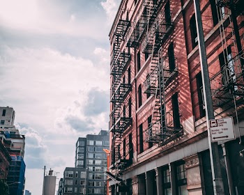 Brown Concrete Building Under Cloudy Sky