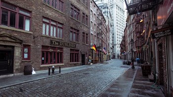 brown concrete building with alley