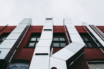 Brown Concrete Building With Grey Air Ventilatios