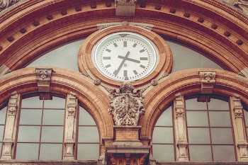 Brown Concrete Hall With Clock