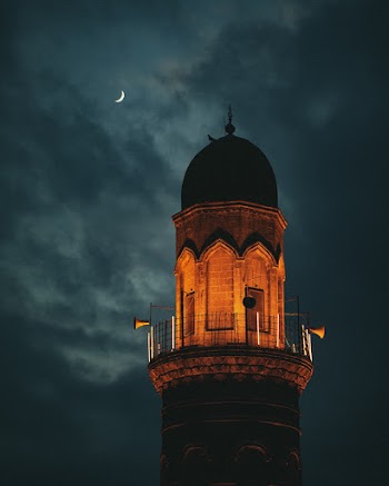 Brown Concrete Tower at Night