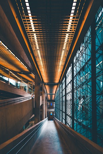 Brown Concrete Wall Leading to Opened Space at Night
