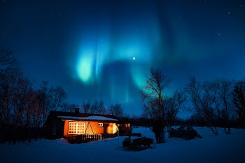 Brown Cottage Under Aurora