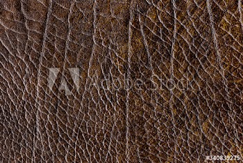Brown creased leather textured background