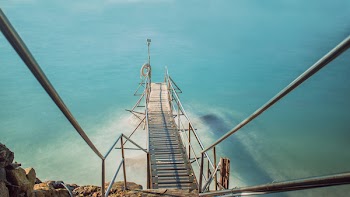 Brown Dock Bridge on Body of Water