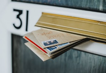 Brown Envelopes in Mail Box