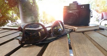 Brown Framed Sunglasses on Brown Wooden Table