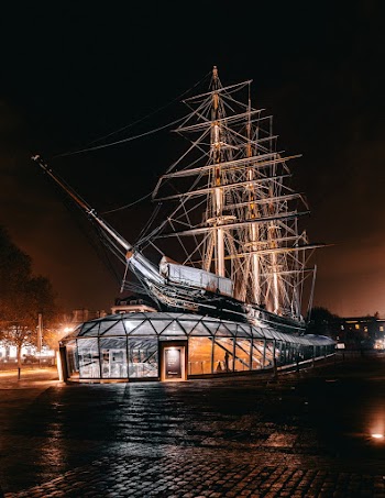 Brown Galleon Ship Themed Building during Nighttime