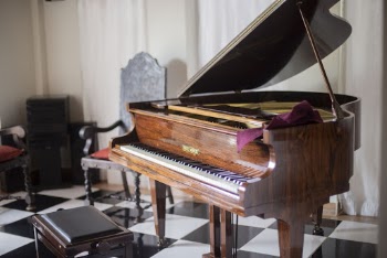 Brown Grand Piano With Chair