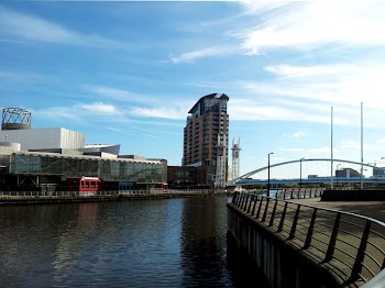 Brown High-rise Building Near Body of Water