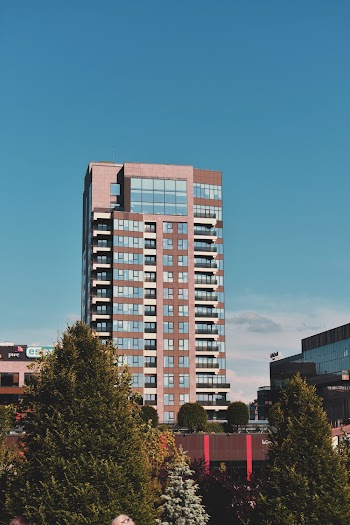 Brown High-rise Building Under Clear Blue Sky