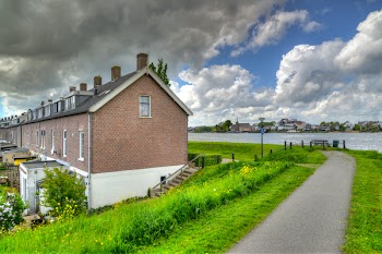 Brown House Near Body of Water