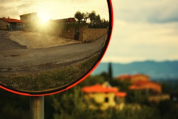 Brown House Reflection on Mirror in Selective Focus Photography
