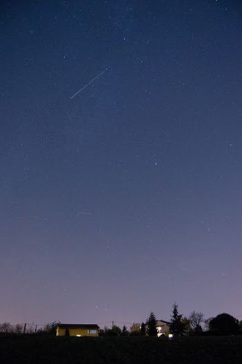 brown house under starry sky during nighttime