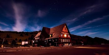 Brown House With Mountain Valley As Background