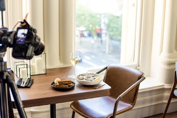 Brown Leather Chair Beside Glass Window