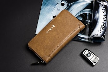 Brown Leather Wallet Beside Black Key Fob