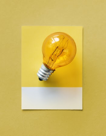 Brown Light Bulb Photo on Yellow Surface