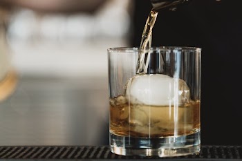 Brown Liquor Being Poured