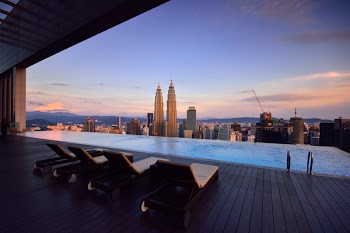 Brown Lounge Chair on Side of Swimming Pool