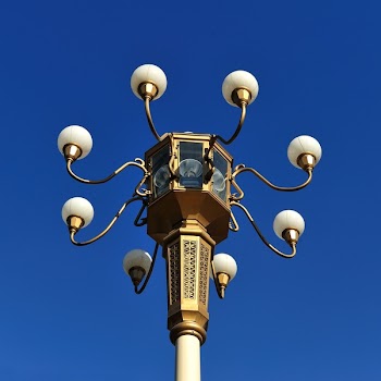 Brown Metal Street Lamp Under Clear Blue Sky during Daytime