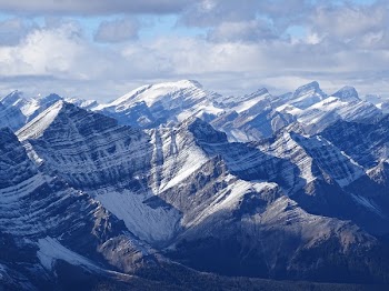 Brown Mountain Alps Under Cloudy Sky