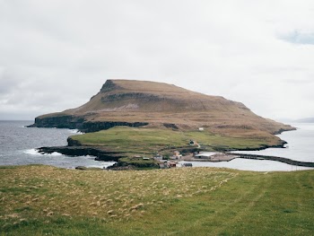 Brown Mountain And Body Of Water