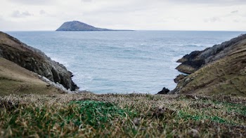 Brown Mountain Near Body of Water