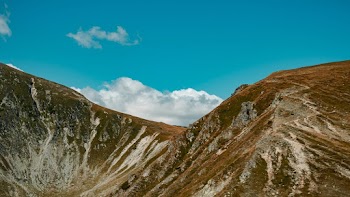 Brown Mountain Under Blue Sky
