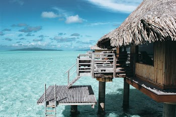 Brown Nipa Hut on Body of Water