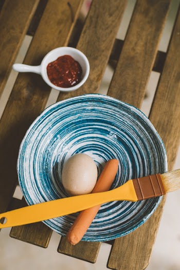 Brown Paintbrush on Blue Ceramic Bowl
