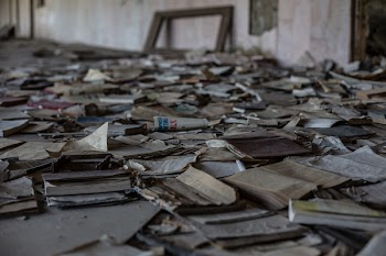 Brown Paper Lot on Floor Near Brown Wall
