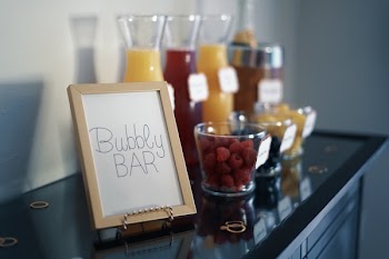Brown Photo Frame Beside Drinking Glass With Fruit Inside
