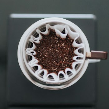 brown powder in white container