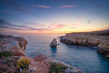 Brown Rock and Body of Water