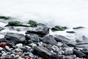 Brown Rock Beside Body of Water