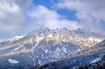 Brown Rock Formation Covered With White Snow