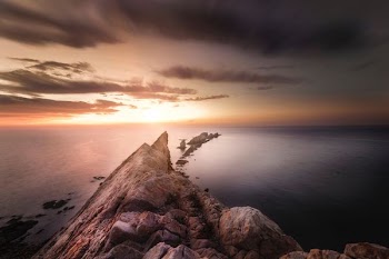 brown rock formation during sunset