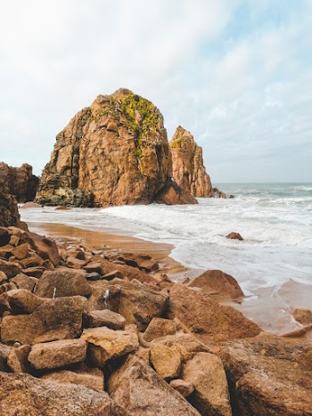 Brown Rock Formation on Sea Shore
