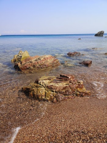 Brown Rock Formation on Sea Shore