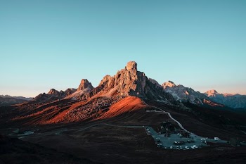 brown rock formation under blue sky