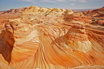brown rock formation under sunny sky