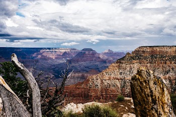 Brown Rock Formation Under White Clouds