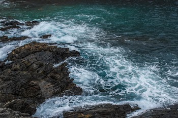 Brown Rock in Body of Water