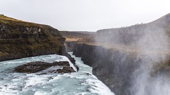 brown rock mountain and river