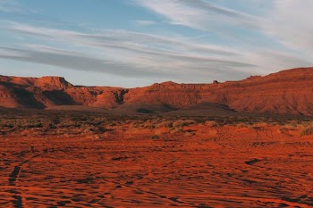 brown rocky mountain under clear blue cloudy sky