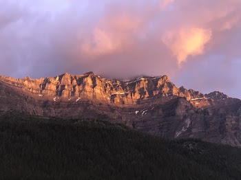 Brown Rocky Mountain Under Cloudy Sky